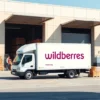 A modern delivery truck with Wildberries logo parked in front of a warehouse, packages being loaded by workers, clean urban background, bright daylight, professional logistics scene